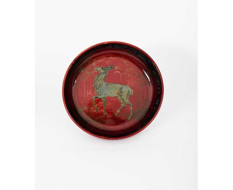 A Bernard Moore flambe bowl, decorated to the well with a deer walking in a woodland setting, in blue and yellow on a flambe 