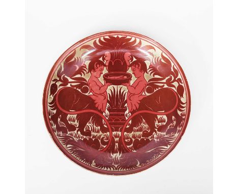 A William De Morgan charger by Charles Passenger, painted with two figures, half-boy-half lion, offering up a bowl before a f