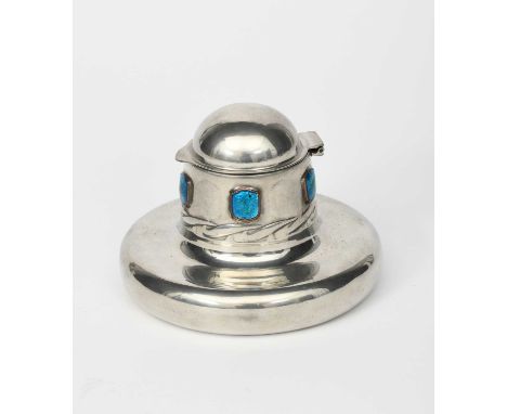 A Liberty Tudric Pewter and enamel inkwell designed by Archibald Knox, model no.0164, compressed circular form, the neck with