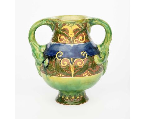 A Della Robbia Pottery vase by John Fogo and possibly Jessie Sinclair, shouldered twin-handled form, the handles cast with ma