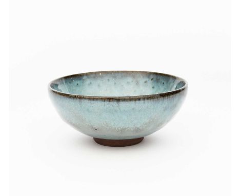 A Chelsea Chun stoneware bowl by Charles Vyse, covered in a running blue and lavender glaze, incised C Vyse Chelsea, 16cm. di