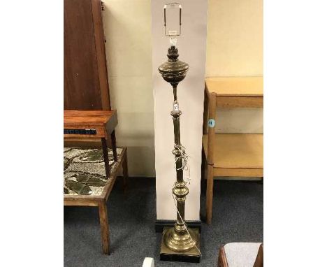 A heavy brass standard lamp 