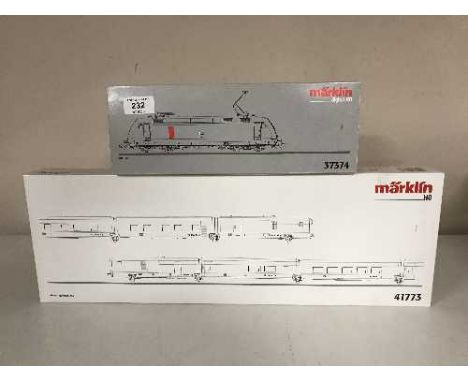 A Marklin 37374 diesel locomotive together with a 41773 Express Train Passenger Car Set (HO Scale), boxed 