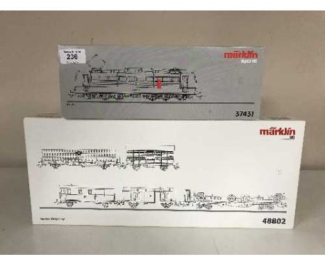 A Marklin 37431 diesel locomotive together with a  48802 transfer train car set (HO Scale), boxed 