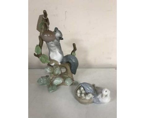 Two Lladro figures - squirrel and a swan with signets 