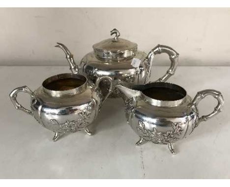 An early 20th century Chinese silver three-piece tea service, maker Lainchang, 30.3oz, teapot 14cm high. (3)