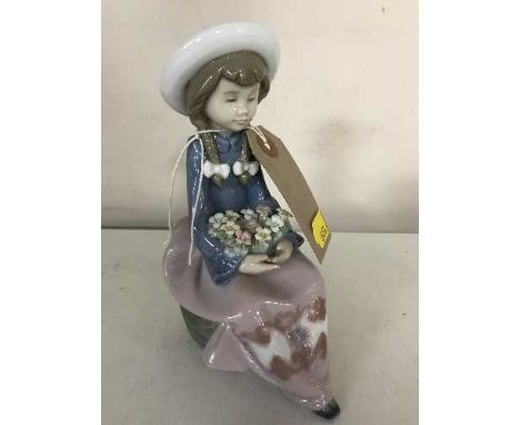 A Lladro figure - girl with flowers numbered 5554 