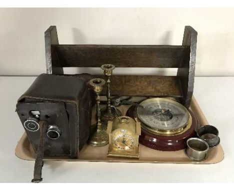 A tray of wooden book trough, two cameras, miniature mantel clock, barometer and a silver & silver plated napkin ring 