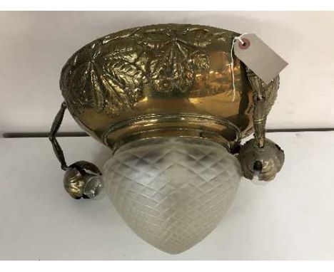 An early twentieth century brass light fitting with leaf decoration with opaque moulded glass shade