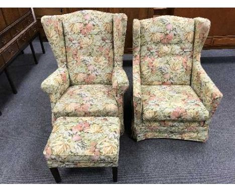 A pair of floral upholstered button back armchairs and a footstool 