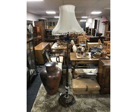 A mahogany standard lamp with shade 