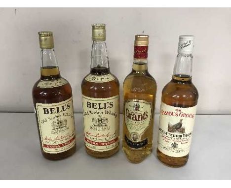 Two one litre bottles of Bells Extra Special Old Scotch whiskey, a 75 cl bottle of Grants Scotch whiskey and a 75 cl bottle o