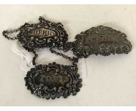 Three silver decanter labels; Port, Sherry and Whisky