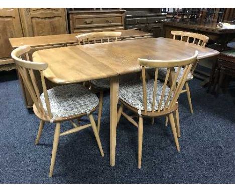 A six-piece elm Ercol dining room suite 