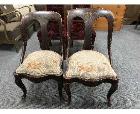 A pair of painted mahogany spoon back chairs 