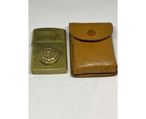 A LEATHER CASED MILITARY CIGARETTE LIGHTER 