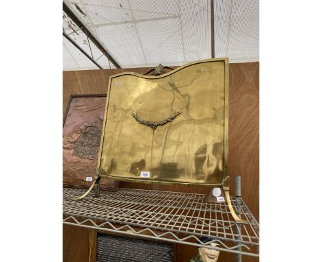 A DECORATIVE BRASS FIRE SCREEN 