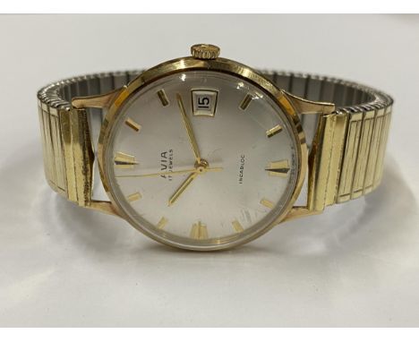 A GENTS 9CT GOLD CASED AVIA MANUAL WIND DATE WATCH WITH FLEXI STRAP IN ORIGINAL BOX 
