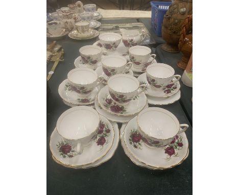 A COLCLOUGH TEASET WITH ROSE PATTERN TO INCLUDE CUPS, SAUCERS, SIDE PLATES, A CAKE PLATE, CREAM JUG AND SUGAR BOWL 