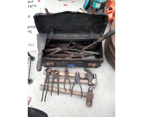 A TOOL BAG CONTAINING VARIOUS HAMMERS, SPANNERS, ETC 