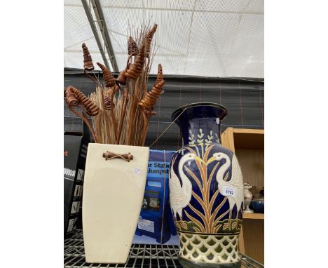 A PLAIN CERAMIC VASE AND A FURTHER CERAMIC VASE DEPICTING SWANS 