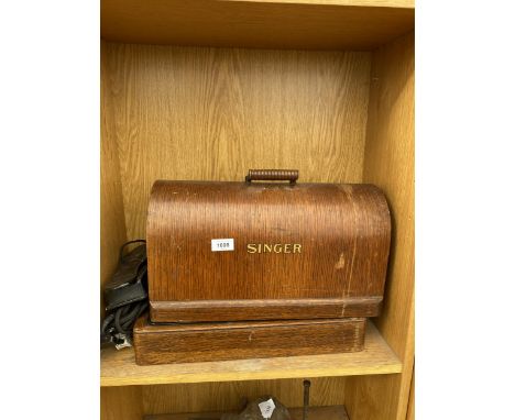A VINTAGE SINGER SEWING MACHINE CONVERTED TO ELECTRIC AND WITH WOODEN CARRY CASE 