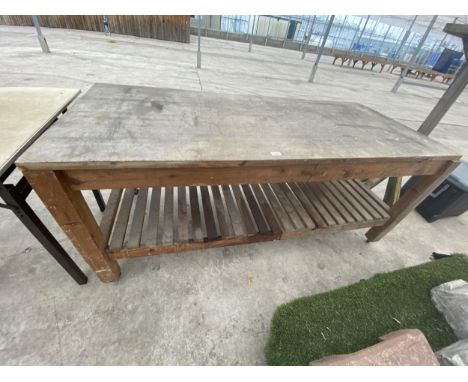 A HARDWOOD POTTING TABLE WITH LOWER SHELF 