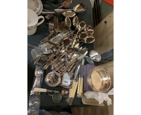 A LARGE QUANTITY OF FLATWARE TO INCLUDE KNIVES, FORKS, SPOONS, A TABLE LIGHTER, BOTTLE COASTER, ETC 