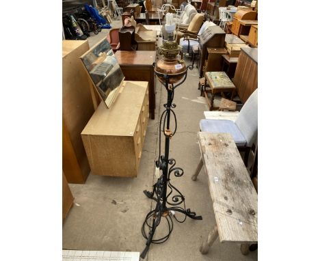 A BLACK WROUGHT IRON AND COPPER OIL STANDARD LAMP, CONVERTED TO ELECTRICITY 