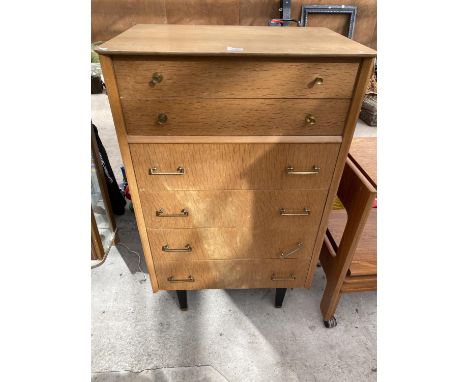 A MID 20TH CENTURY LIGHT OAK 'LIMELIGHT' CHEST OF TWO SHORT AND FOUR LONG DRAWERS, ON BLACK TAPERING LEGS, 26.5" 