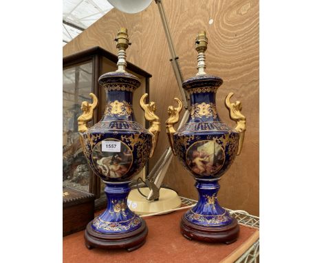 A PAIR OF BLUE CERAMIC ORIENTAL STYLE TABLE LAMPS WITH CHERUB DESIGN 