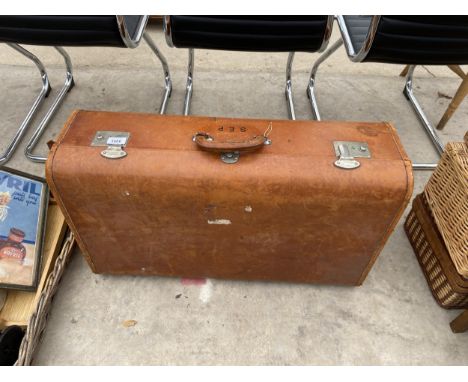A VINTAGE LEATHER SUITCASE WITH S.E.P MONOGRAM 