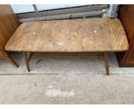 AN ERCOL ELM COFFEE TABLE WITH MAGAZINE SHELF, 41X18" 