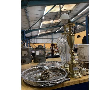 A LARGE CRYSTAL LAMP BASE TOGETHER WITH A BRASS LAMP BASE AND TWO SILVER PLATE TRAYS 