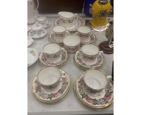 A ROYAL WORCESTER 'ROYAL GARDEN' TEASET TO INCLUDE A CAKE PLATE, CREAM JUG, SUGAR BOWL, CUPS, SAUCERS AND SIDE PLATES 