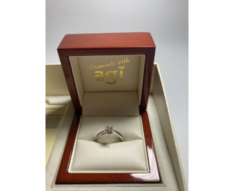 AN 18 CARAT GOLD WIRE SET DIAMOND RING WITH A 0.33 CARAT DIAMOND WITH A 'VERY GOOD' QUALITY E CUT DIAMOND SIZE M/N IN PRESENT