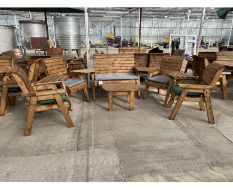 AN AS NEW EX DISPLAY CHARLES TAYLOR PATIO SEATING SET COMPRISING OF A TWO SEATER BENCH, FOUR CHAIRS, A COFFEE TABLE AND FOUR 