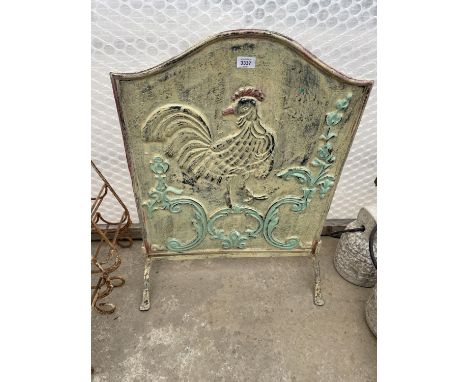 A HEAVY CAST IRON FIRESCREEN WITH FOLIATE DECORATION FEATURING A COCKEREL 