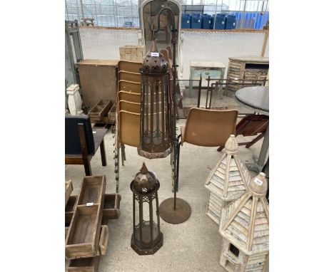 A METAL HANGING LANTERN AND STAND AND FURTHER LANTERN 