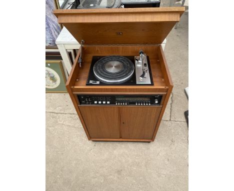 A RETRO TEAK STEREO UNIT CONTAINING A DYNATRON GOLDRING RECORD PLAYER AND A DYNATRON STEREOPHONIC TUNER AMPLIFIER ETC 