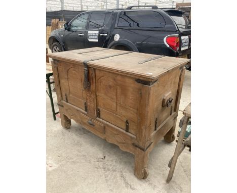A VINTAGE INDIAN HARDWOOD DOWRY CHEST WITH METAL HINGES AND SUPPORTS 