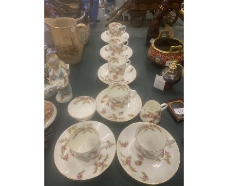 A VINTAGE CHINA PART TEASET WITH PINK FLORAL PATTERN TO INCLUDE CUPS, SAUCERS, CREAM JUG AND A SUGAR BASIN 