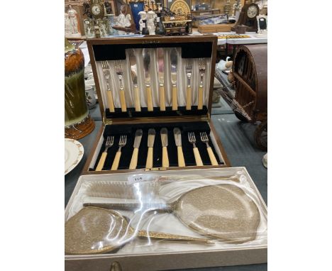 A VINTAGE FISH KNIFE AND FORK SET CASED IN A MAHOGANY BOX 