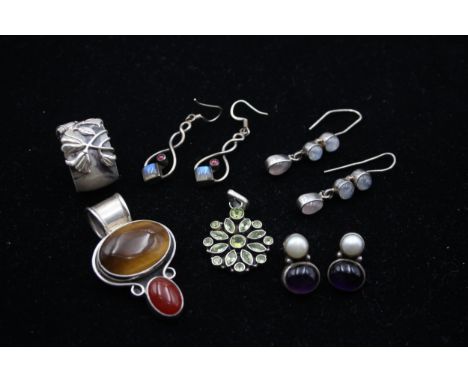 Two silver and gemset pendants, three pairs of ear rings and a ring, 63gm 