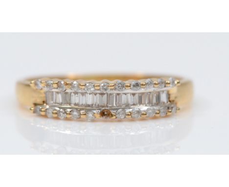 An 18ct gold baguette and brilliant cut diamond dress ring, R, 2.9gm 