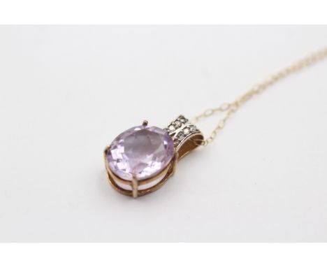 A 9ct gold amethyst and diamond pendant, 18mm, chain, 2.4gm 