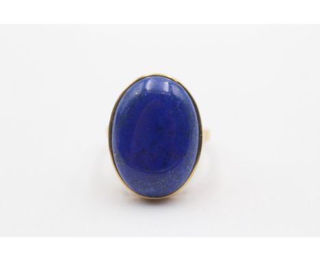 A 9ct gold and lapis lazuli dress ring, 24 x 17mm, T, 7.5gm 