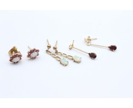 A 9ct gold pair of opal and ruby cluster ear studs, an opal drop pair and a garnet drop pair, 3gm 