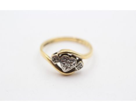 A vintage 18ct gold and diamond three stone heart ring, L, 2.7gm 