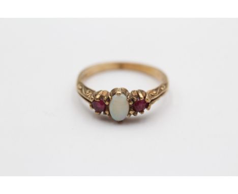 A vintage 9ct gold ruby and opal three stone ring, N, 2.2gm 